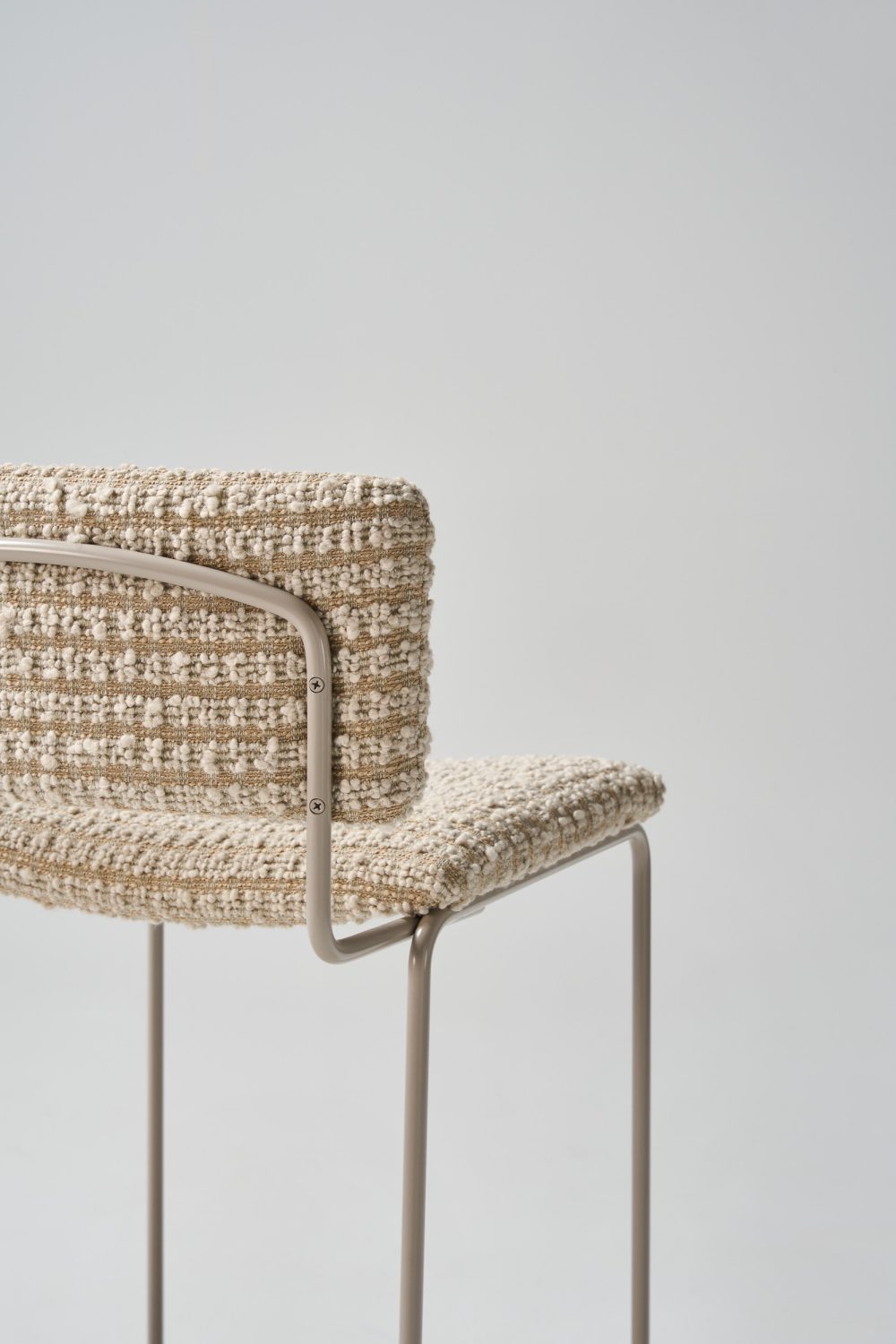 detail Dita stool with custom upholstery with dune pc legs