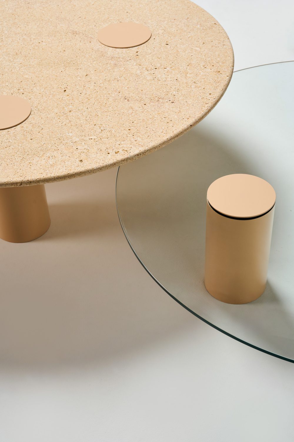 detail Ivy coffee tables with reef stone top and lama pc legs and clear glass top with lama pc legs