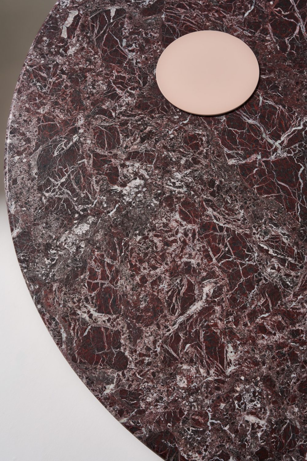 detail ivy coffee table with rosso antico stone top and pink sand pc legs