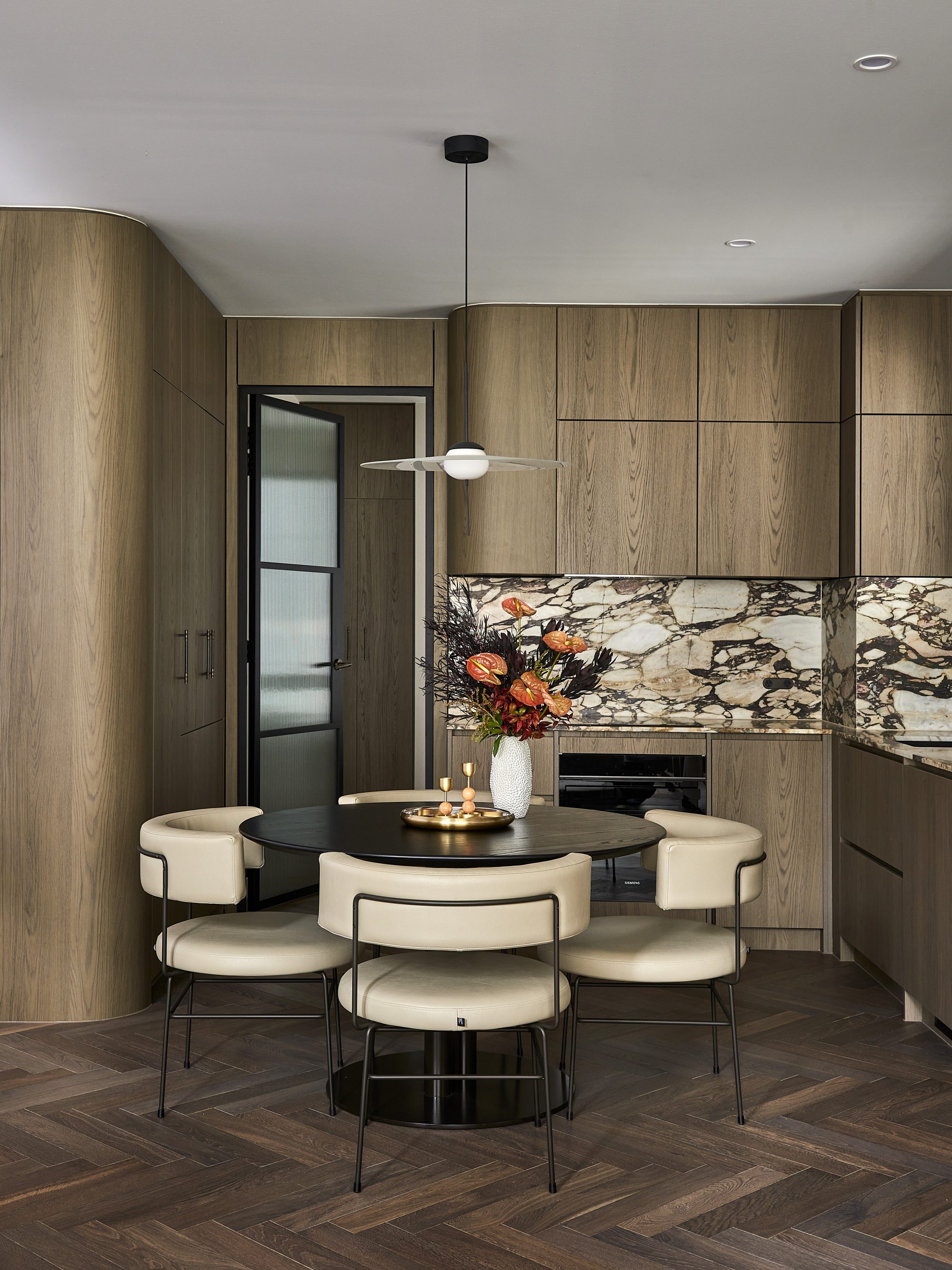 1200dia pillar dining table in solid timber top with Big diiva chairs