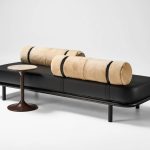 Etta ottoman in black leather and bolster in natural sheepskin