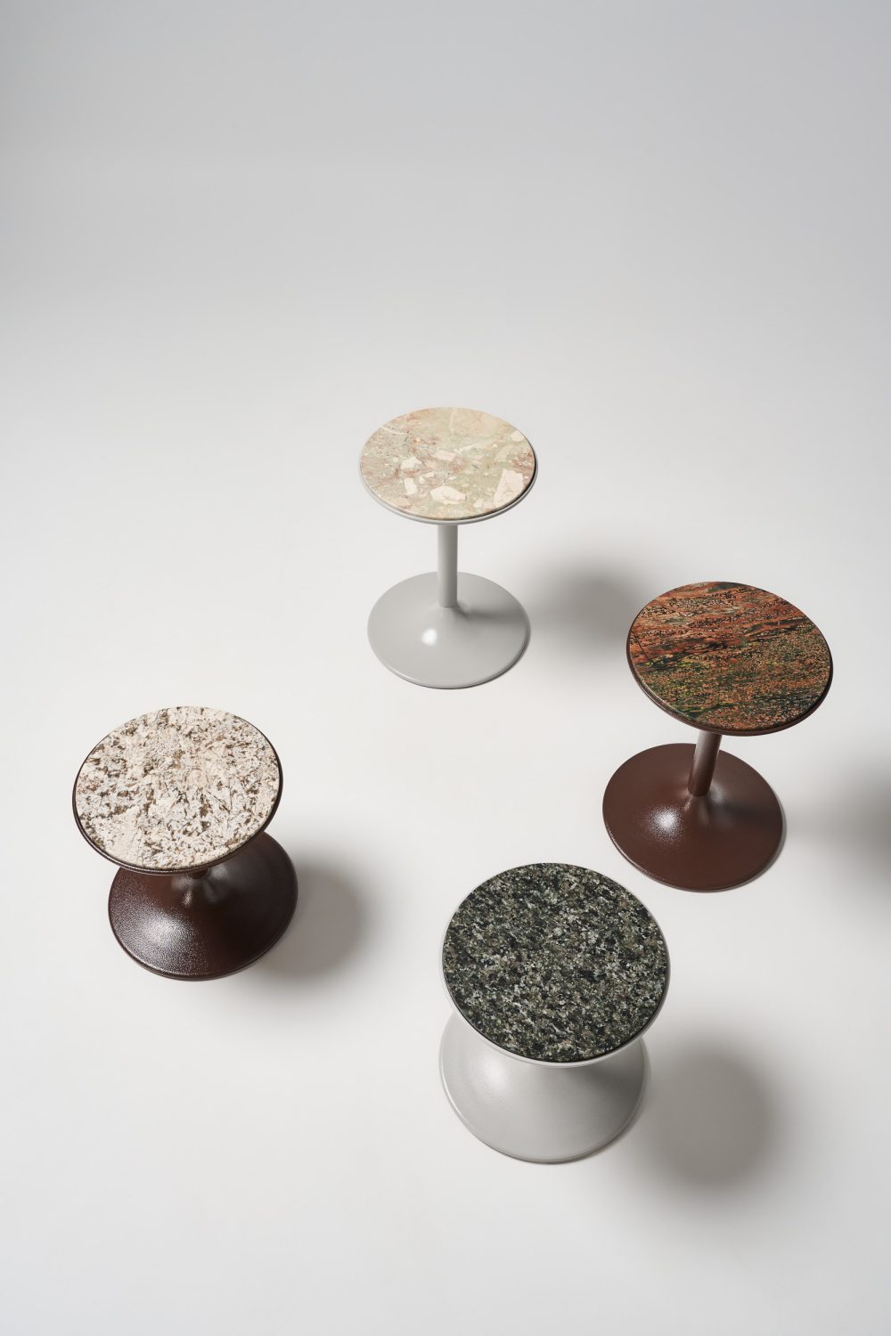 Cluster of porter side tables in house stone finishes