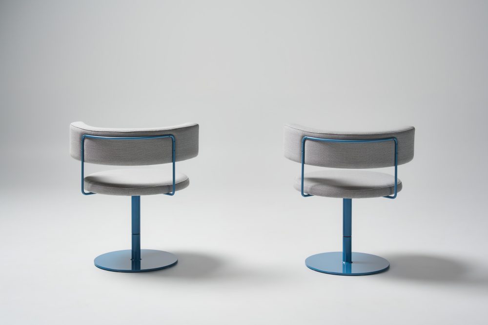 Big diiva swivel chairs in custom upholstery and wedgewood blue pc base back view