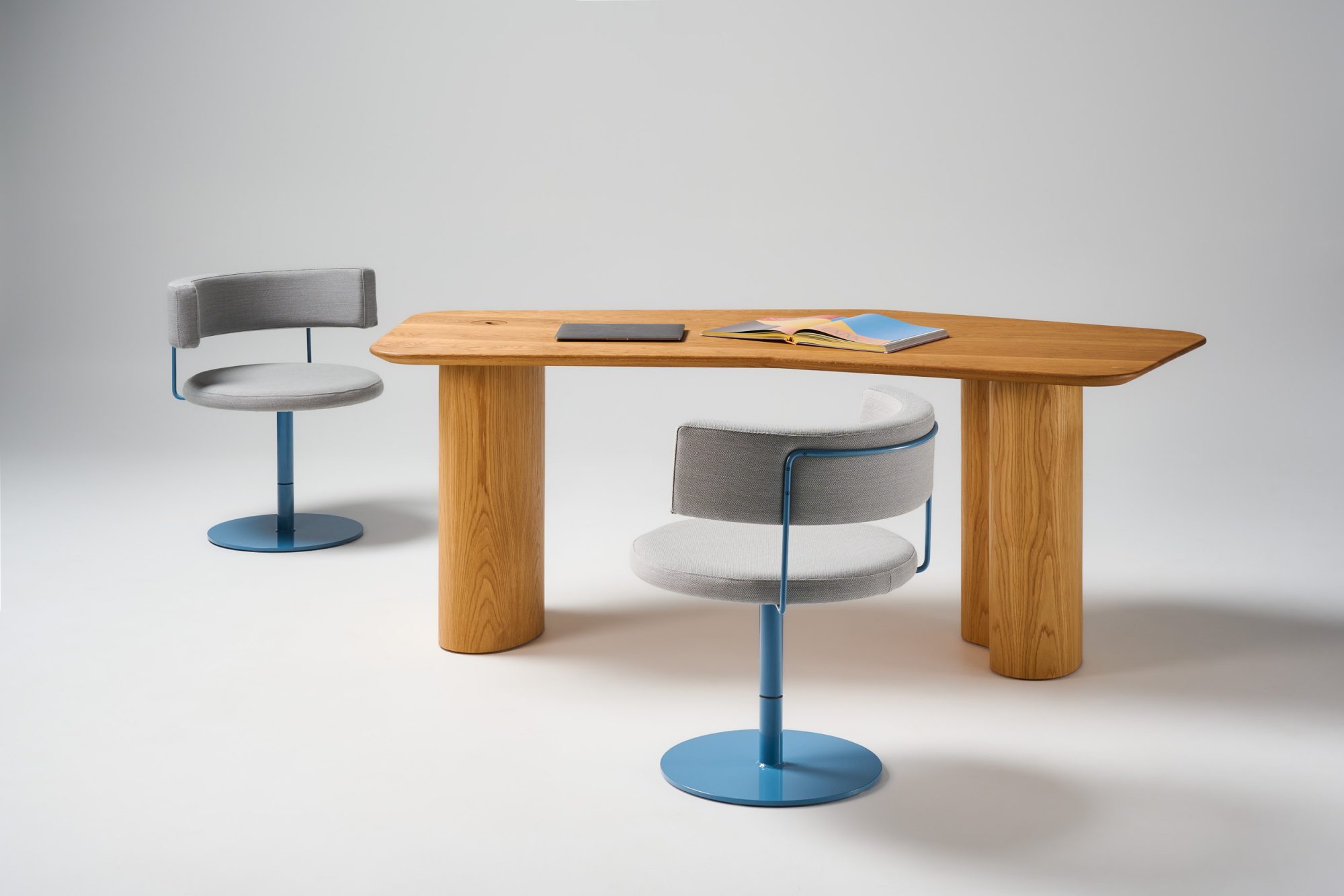 Prince desk in solid oak and big diiva swivel stools in custom upholstery and wedgewood blue pc