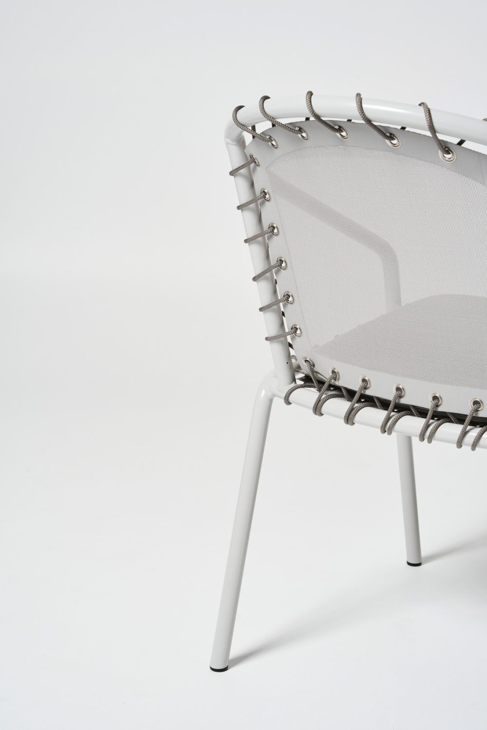 Back of Grey Spring Stacking Chair